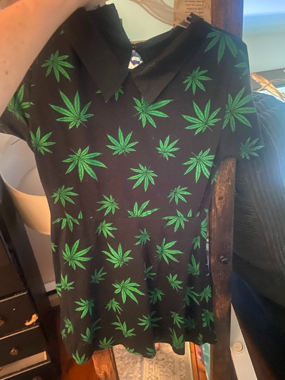 Skater-style mini dress features an all-over bright green cannabis